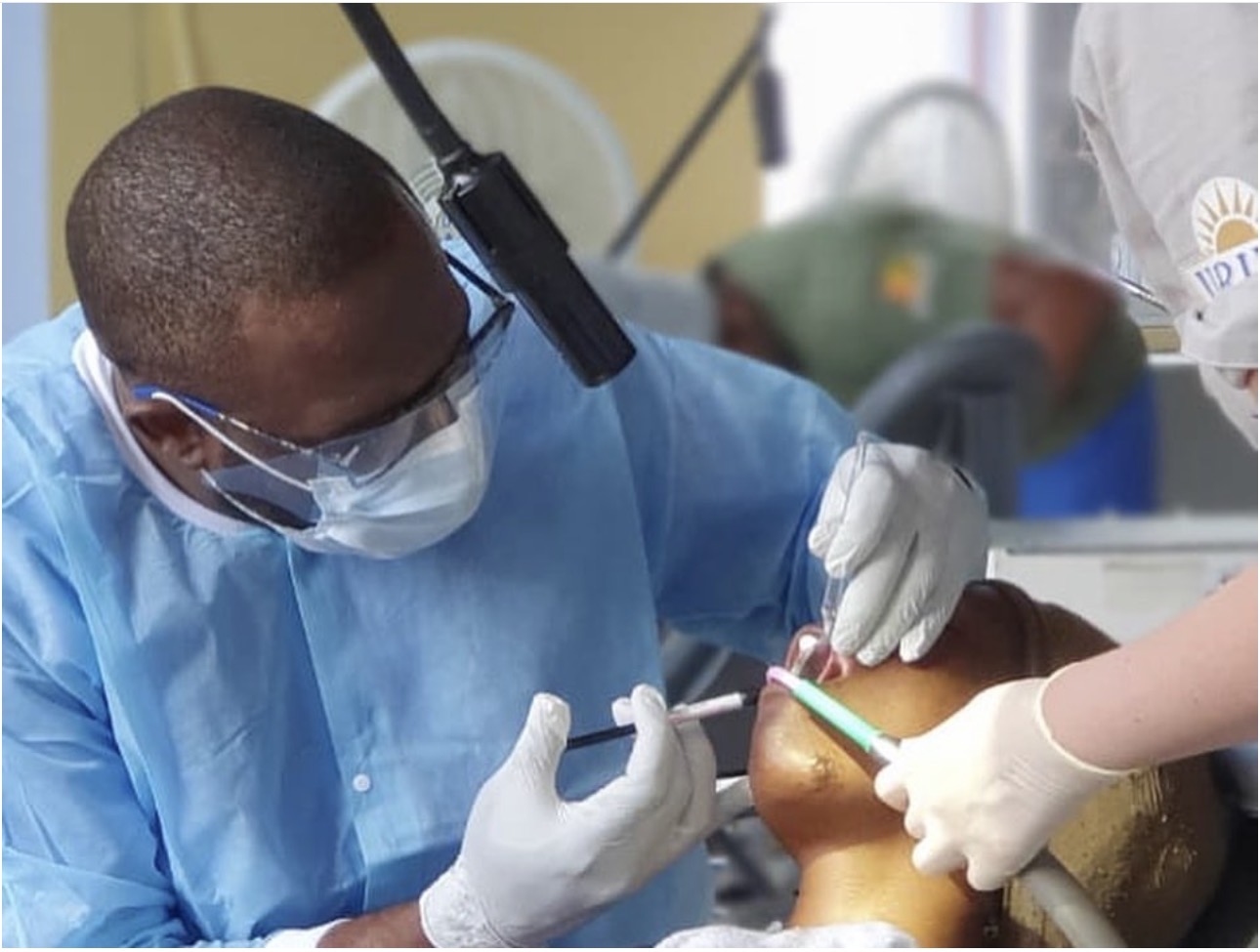 FLOSS Jamaica clinician delivering dental care during outreach